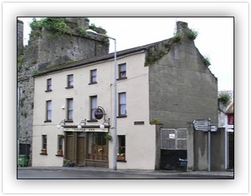 End of terrace four-bay three-storey house, built c. 1800, with pubfront, also in use as public house.