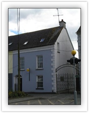 Town & Country Main Street, Fethard, Tipperary South 	End-of-terrace two-bay two-storey house, built c. 1860, later used as offices, now disused, with attic, with recent three-bay single-storey extension to rear with monopitch artificial slate roof. Pitched artificial slate roof .