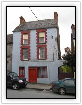 Thumbnail Picture: Main Street, Fethard, Tipperary South 	End-of-terrace Two-bay three-storey house, built c. 1900, with disused shopfront, with carriage arch to west