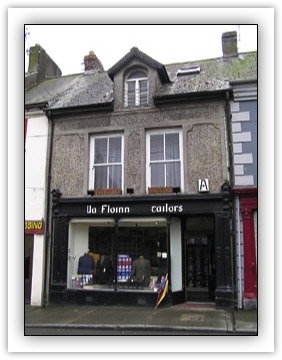 Terraced two-bay two-storey house, built c. 1900, with dormer storey, also in use as shop