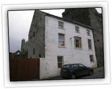 Three-bay three-storey house, built c.1450 and raised in height c.1550