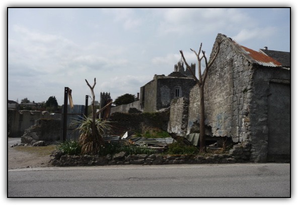 Works being undertaken to improve the visibility of town wall at Bucky Ryans Fethard.